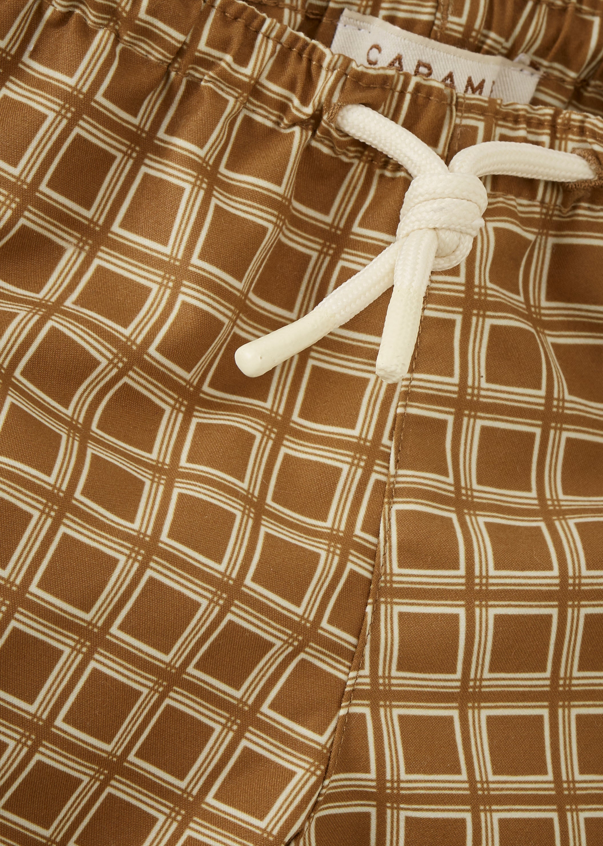 KOHLRABI BOY'S SWIM SHORTS - BROWN GEO PRINT