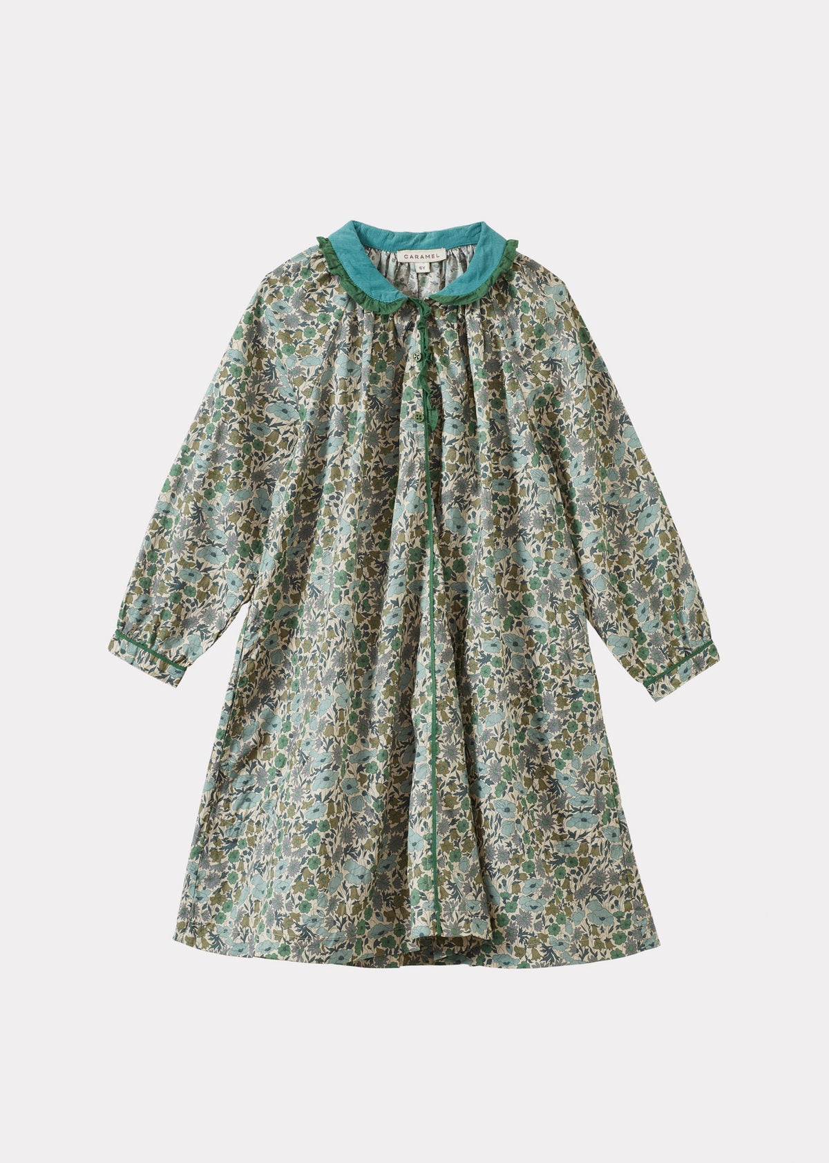 A long-sleeve babydoll dress with a green and beige floral print, featuring a contrasting teal collar and buttoned front, shown against a light gray background.